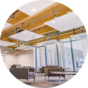 A circular image of a specifically designed Cloud system in a common area with seating options.
